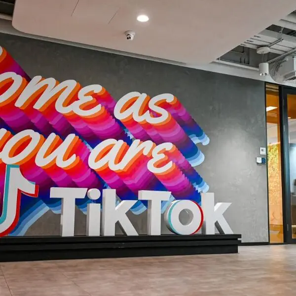 Colorful "Come as you are" TikTok mural.