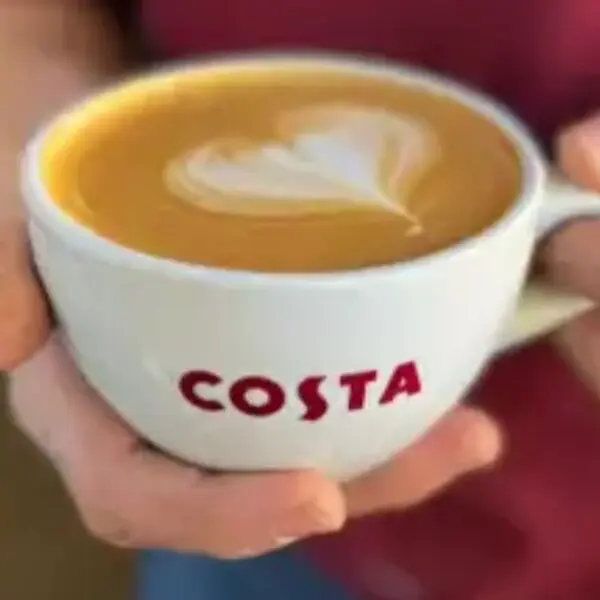Coffee cup with heart-shaped latte art.