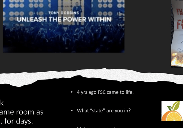 Conference stage with "Unleash the Power Within.