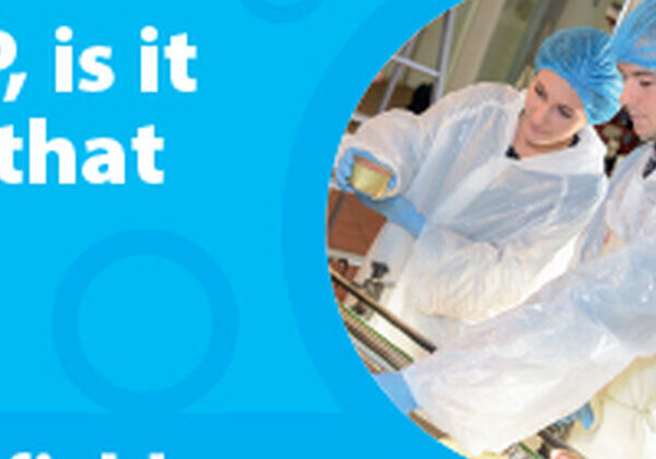 People in protective clothing inspecting food.