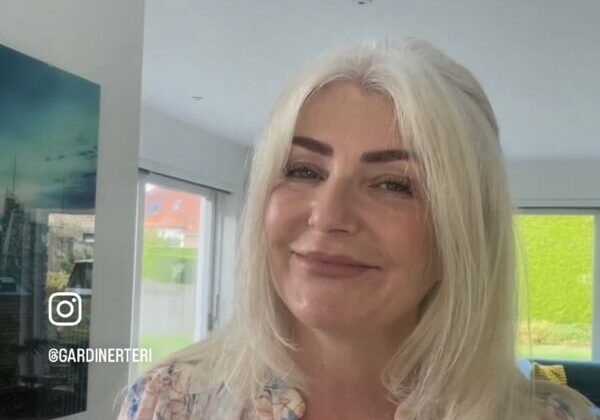 Smiling woman indoors with "Audits!" text.