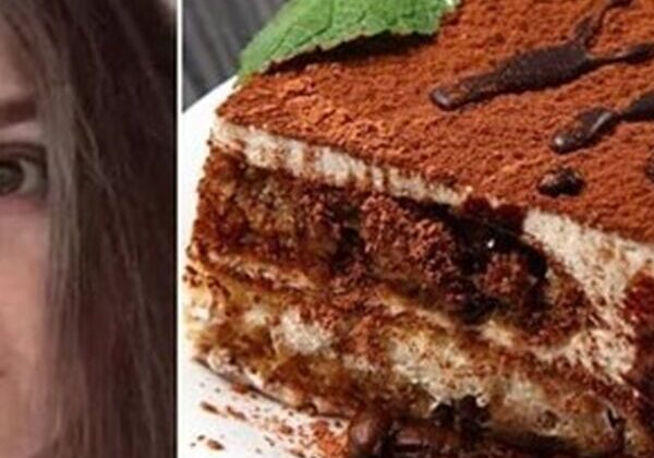 Tiramisu dessert with mint leaf garnish.