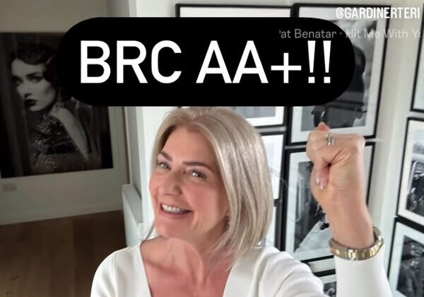 Smiling woman celebrating BRC AA+ rating.