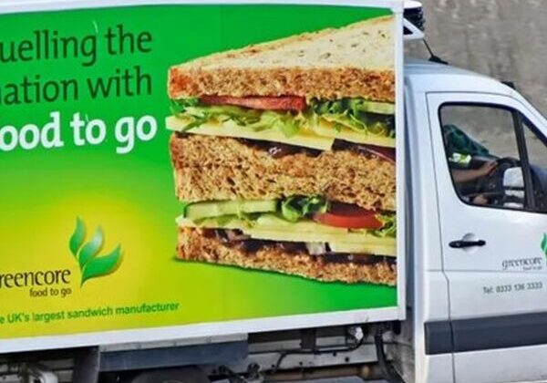 Truck with sandwich advertisement on the side.