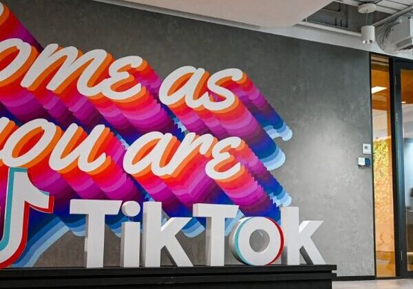 Colorful "Come as you are" TikTok mural.