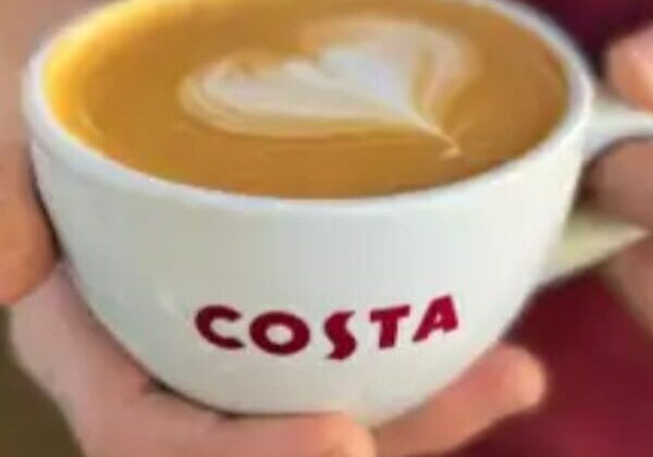 Coffee cup with heart-shaped latte art.